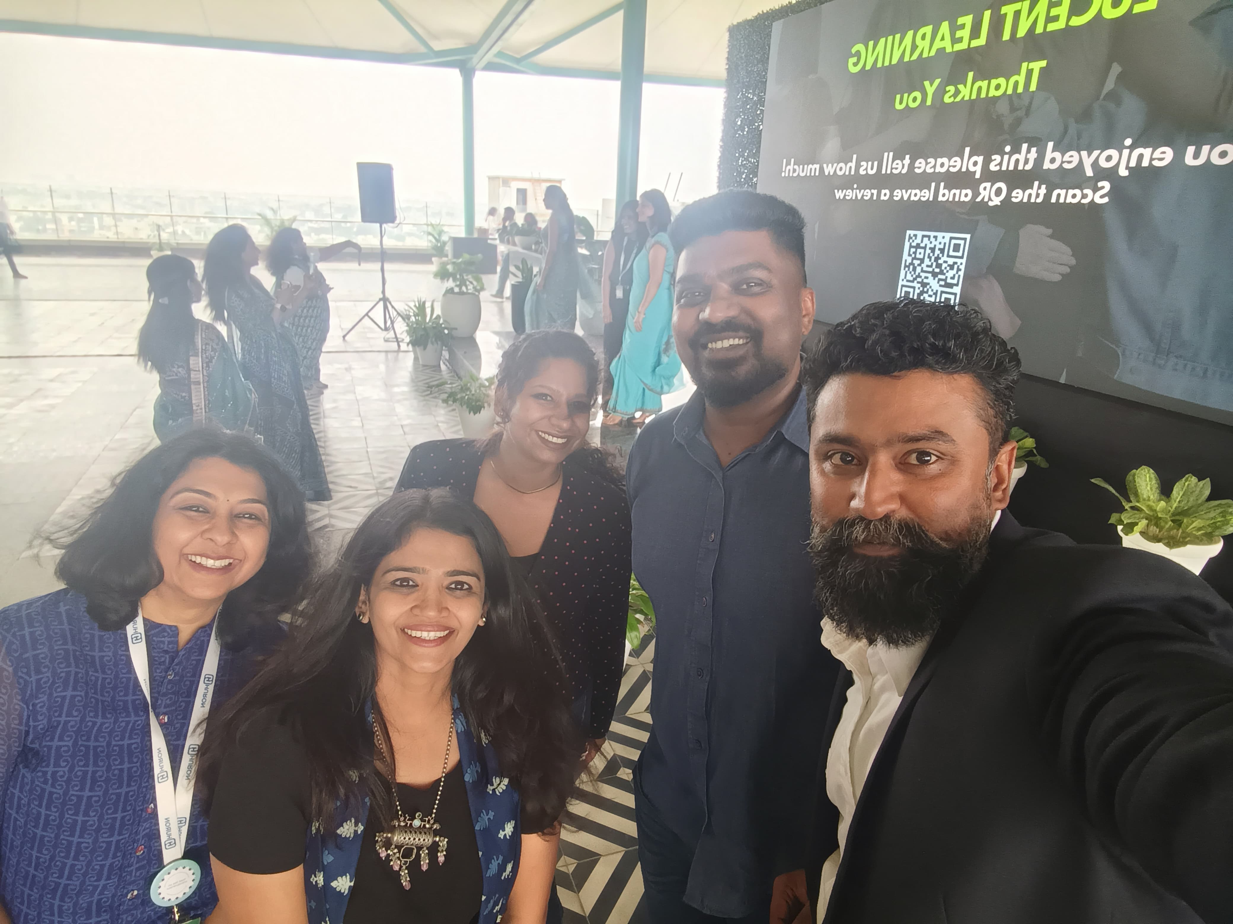 Participants enjoying the rooftop networking session